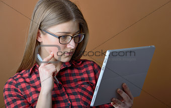 Teenage girl with tablet at home