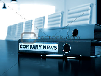 Company News on Office Binder. Toned Image.