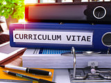 Curriculum Vitae on Blue Office Folder. Toned Image.