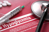 Hypoglycemia. Medical Concept on Red Background.