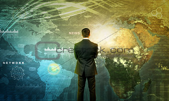 Businessman in front of world map