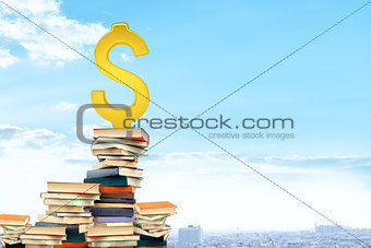 Dollar sign on pile of books