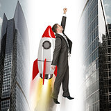 Businessman flying on rocket