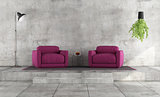 Minimalist living room with purple armchairs