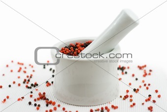 mortar and pestle crushing pepper