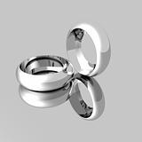 Platinum Wedding Rings on mirrored surface