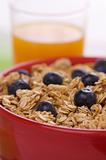 Bowl of Granola and Blueberries and Juice