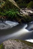 water cascade in forest in czech republic in europe
