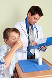 Sick child taking medicine
