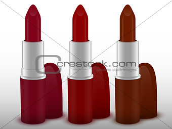 Three tubes of lipstick