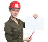 Young worker woman holding a blank poster
