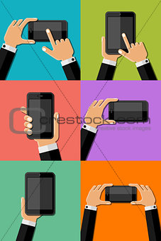 Hands holding mobile phones