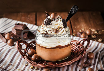 Chocolate mousse decorated with whipped cream