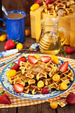 Belgian pumpkin waffles decorated with fresh fruits 
