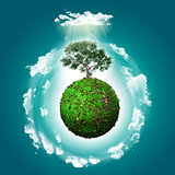 3D grassy globe with a tree and clouds