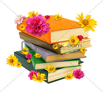 Pile of books with flowers