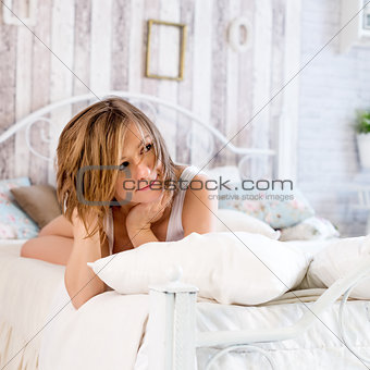 Woman lying on the bed