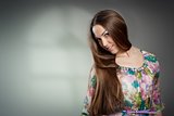 Portrait of beautiful young woman wiht long hair