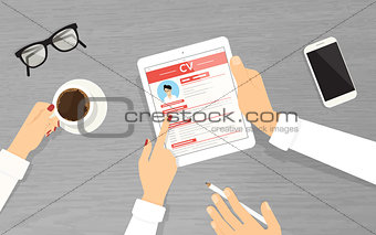 HR managers searching an employee using tablet pc in the office