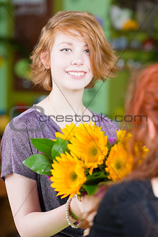 Teen Girl in Flower Shop Purchases Sunflowers