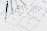 Engineer Pencil, Ruler and Compass Resting on House Plans