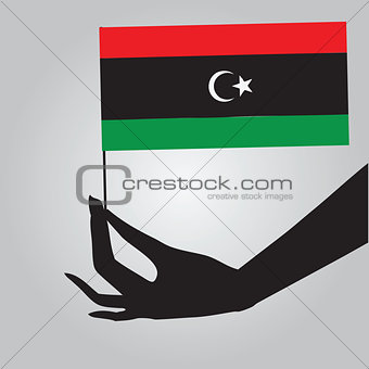 Hand with flag Libya