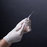 Hands with syringe
