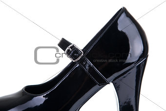 Close-up shot of black shoe with strap belt 