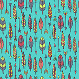 Seamless pattern with arrows and feathers