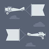 Flying biplanes with blank greetings banner (flag)