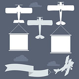 Flying biplanes with blank greetings banner