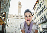 Woman tourist in the front of Palazzo Vecchio in Florence, Italy