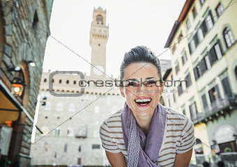 Woman tourist in the front of Palazzo Vecchio in Florence, Italy