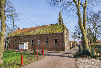 Old church in a street in Oudeschans