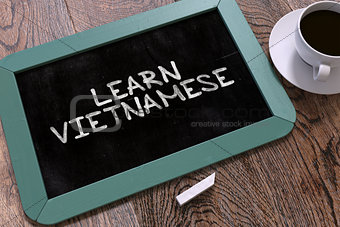 Hand Drawn Learn Vietnamese Concept on Chalkboard.