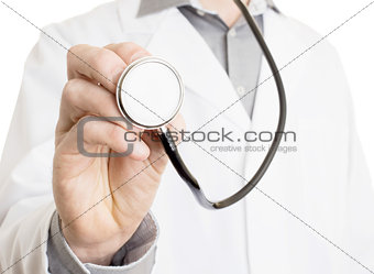 Close up of a Doctor's hand, holding a stethoscope 