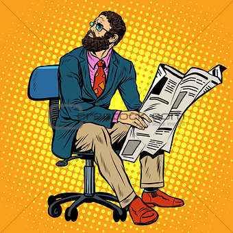 Bearded businessman reading a newspaper