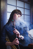 Beautiful young woman with hookah