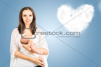 Portrait of mother with newborn baby  with cloud background 