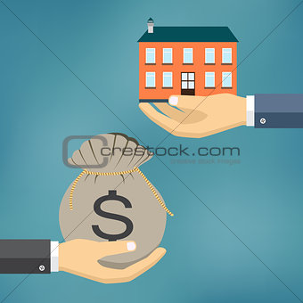 Hands with house and money  bag.