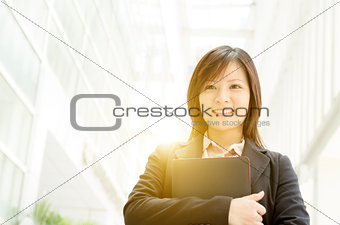 Young Asian business woman with diary