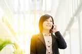 Young Asian business woman on the phone
