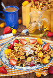 Belgian pumpkin waffles decorated with fresh fruits 