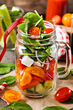 Fresh healthy vegetable salad in glass jar