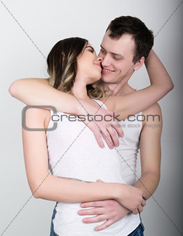 Young and passionate couple in love. Lovers. Couple in love embracing. Sexy beauty couple hugging and kissing
