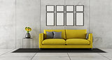 Concrete room with yellow couch