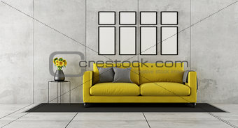 Concrete room with yellow couch