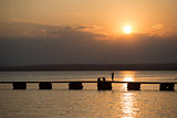 fisherman on sunset at sea