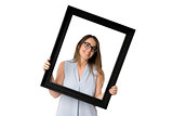 Woman with glasses inside black frame