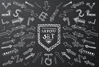 Hand drawn arrow icons set on black chalk board.